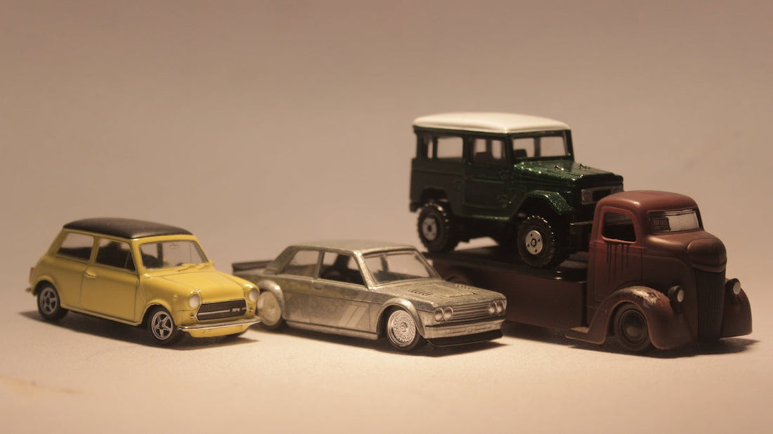a group of toy cars sitting next to each other