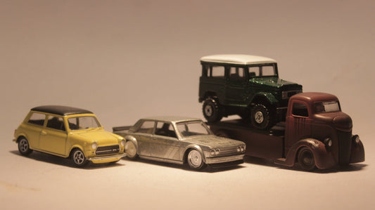a group of toy cars sitting next to each other
