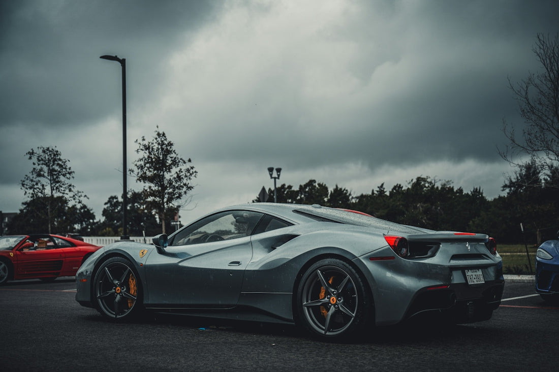 a silver sports car parked in a parking lot
