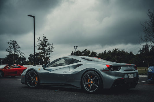a silver sports car parked in a parking lot