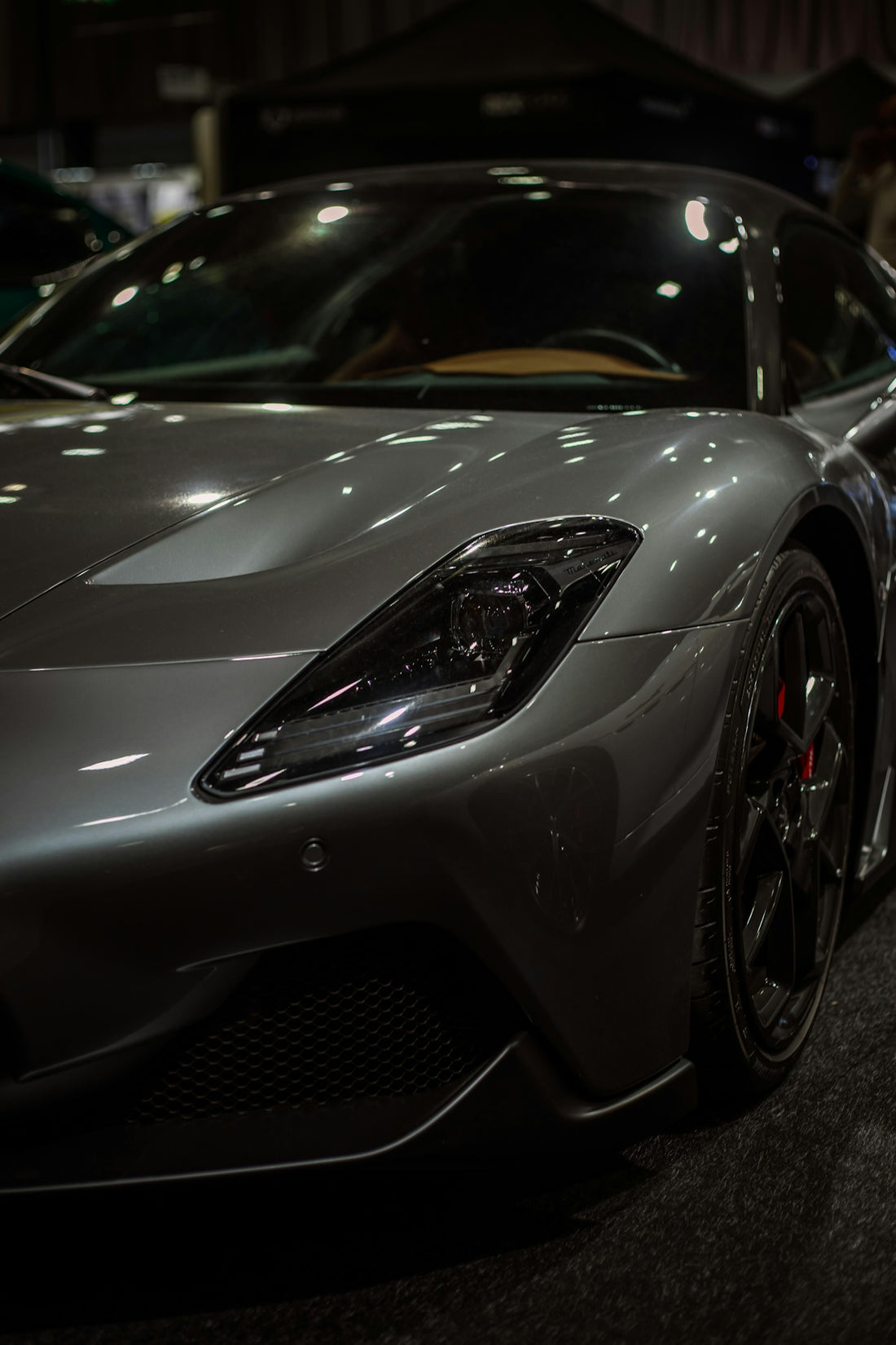 Sleek grey sports car with black rims