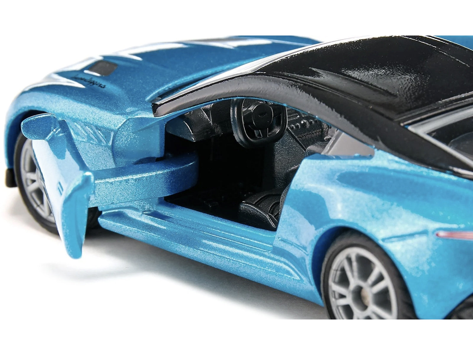 Aston Martin DBS Superleggera Blue Metallic with Black Top Diecast Model Car by Siku - Premium Aston Martin Models from SIKU - Just $20.22! Shop now at Rapidvehicles