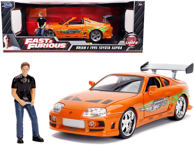 1995 Toyota Supra Orange Metallic with Lights and Brian Figurine "Fast & Furious" Movie 1/18 Diecast Model Car by Jada free shipping USA