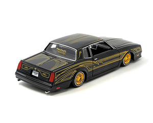 1986 Chevrolet Monte Carlo SS Lowrider Black Metallic with Gold Graphics and Wheels "Lowriders" Series 1/24 Diecast Model Car by Maisto - Premium  from Maisto - Just $50.99! Shop now at Rapidvehicles