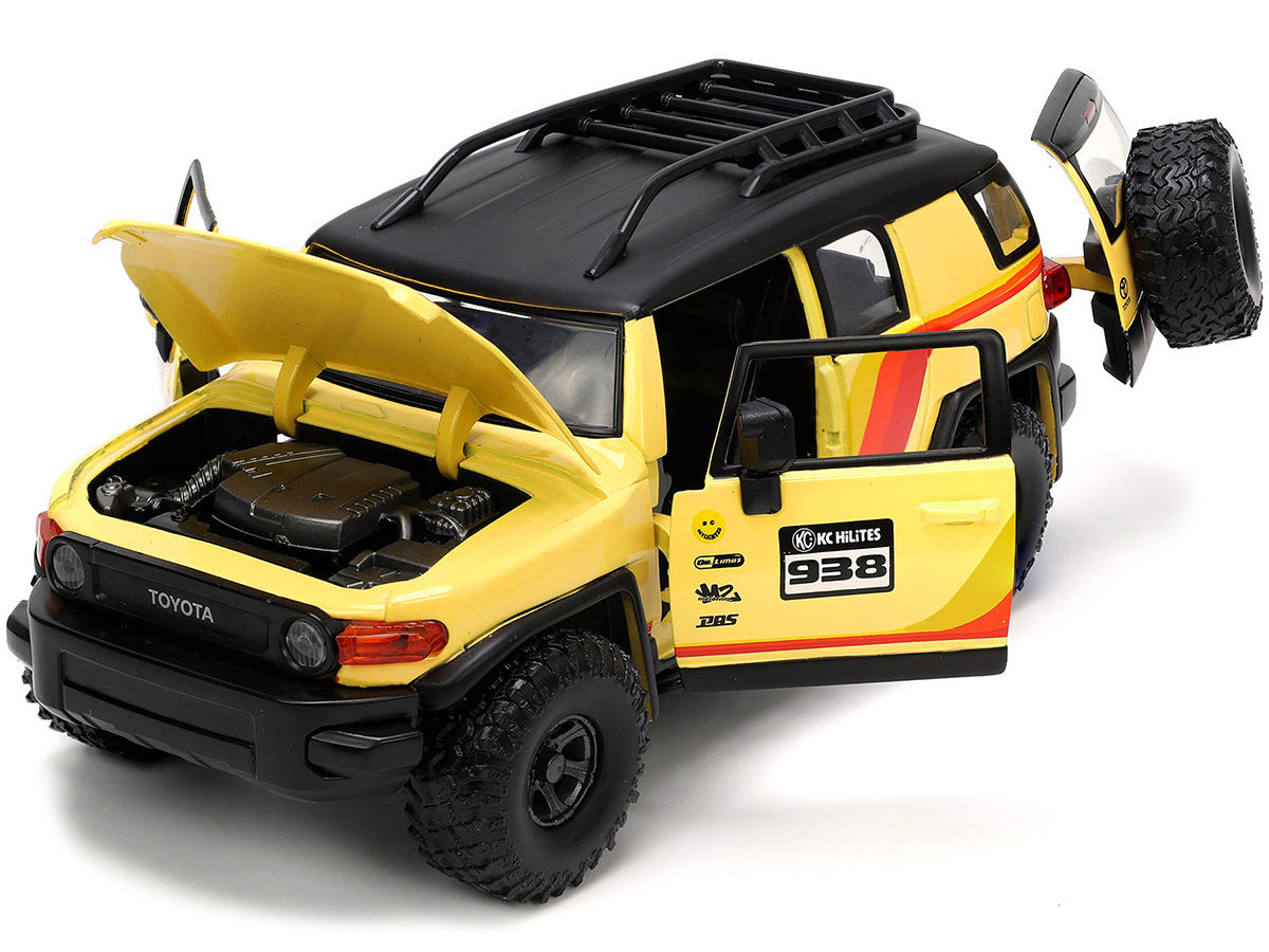 Toyota FJ Cruiser #938 Cream with Matt Black Top with Roof Rack and Stripes "KC Hilites" with Extra Wheels "Just Trucks" Series 1/24 Diecast Model Car by Jada - Premium Toyota Models from Jada - Just $55.09! Shop now at Rapidvehicles