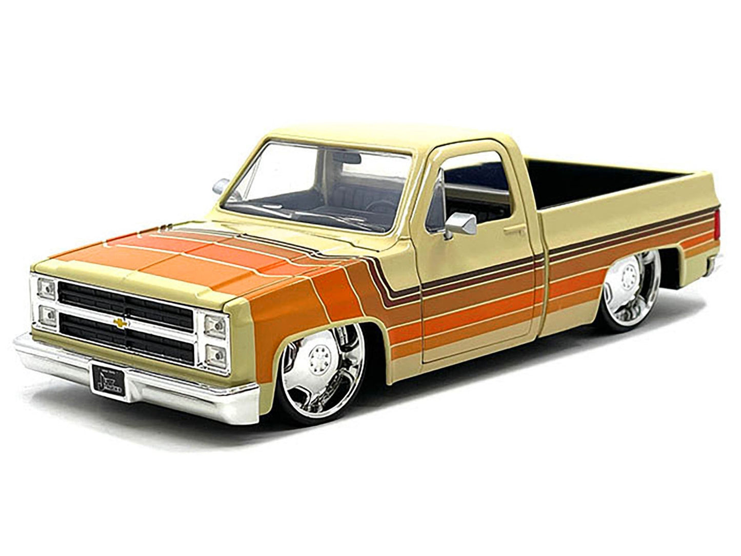 1985 Chevrolet C-10 Pickup Truck Beige with Stripes and Lowenhart - Premium Pickup Trucks Models from Jada - Just $62.99! Shop now at Rapidvehicles