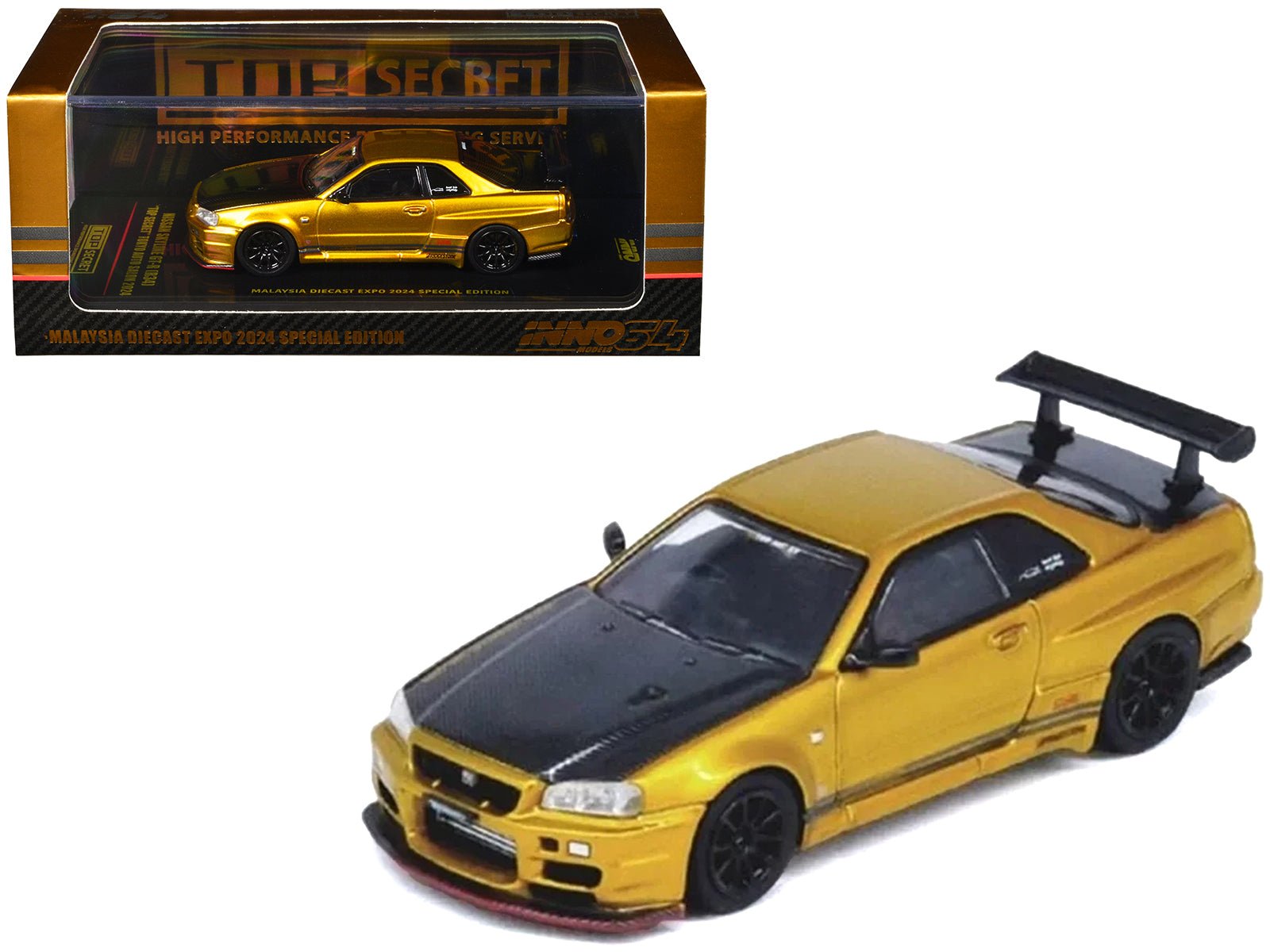 Nissan Skyline GT - R (R34) "Top Secret" RHD (Right Hand Drive) Gold Metallic with Carbon Hood and Trunk "Tokyo Auto Salon 2024 - Malaysia Diecast Expo 2024" 1/64 Diecast Model Car by Inno Models free shipping USA - Rapid Vehicles