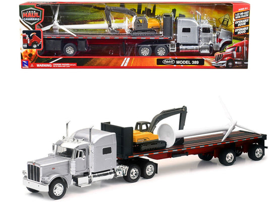 Peterbilt 389 Truck with Flatbed Trailer Silver Metallic with Excavator and Wind Turbine "Long Haul Truckers" Series 1/32 Diecast Model by New Ray free shipping USA - Rapid Vehicles